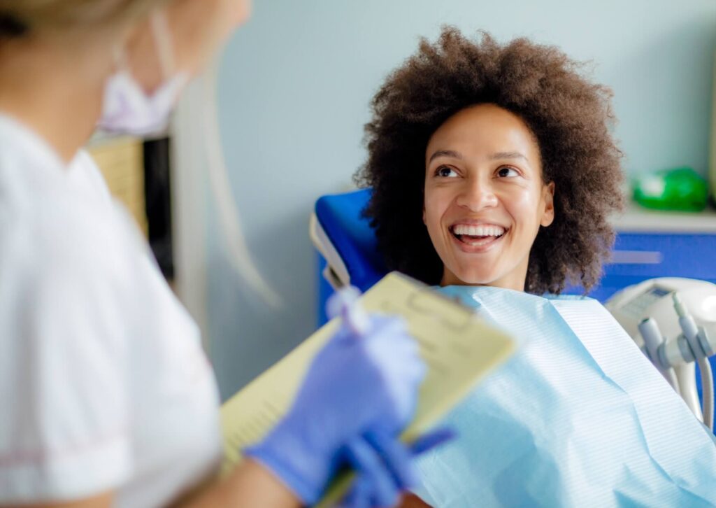 Patient discussing MRI safety with a dentist during a consultation about having an MRI with dental implants.
